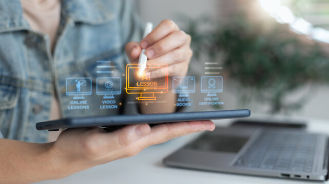 Hand using a tablet with an AI learning interface, online lessons, e-learning platform, video courses, digital education technology, online certification, and smart study with artificial intelligence.