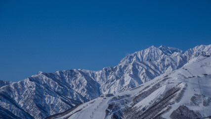 快晴の空と冬の北アルプス　長野県白馬村