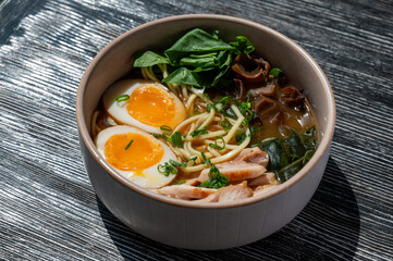 Ramen soup in cafe on wooden table. 