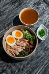 Ramen soup in a cafe. Broth separately. 