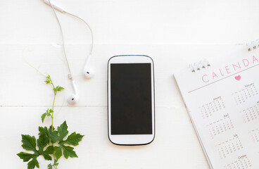 mobile phone with calendar for planner business arrangement flat lay style on background white