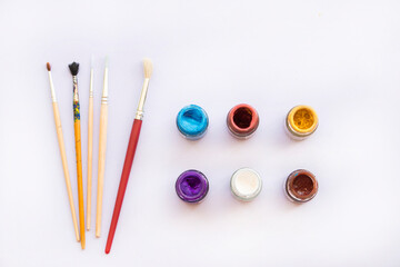 paints, brush and color drawing of lifestyle arrangement flat lay style on background white
