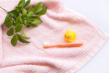 toothbrush with terry cloth health care of baby arrangement flat lay style on background white 