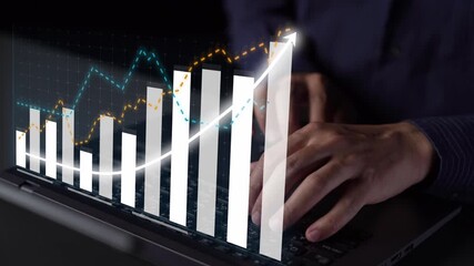 A person types on a laptop while financial graphs and analytics overlay the image, illustrating dynamic growth in investment trends in a modern business environment. Copula - Powered by Adobe