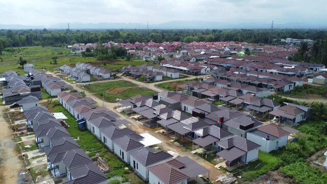 Aerial view of a residential area, some of which is still under construction, surrounded by agricultural areas