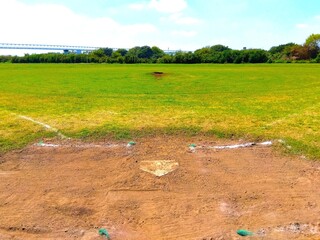 初秋の平日の誰もいない江戸川河川敷の野球場風景