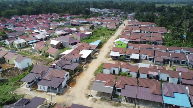 Aerial view of a residential area, some of which is still under construction, surrounded by agricultural areas