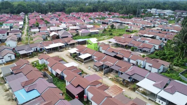 Aerial view of a residential area, some of which is still under construction, surrounded by agricultural areas