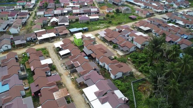 Aerial view of a residential area, some of which is still under construction, surrounded by agricultural areas