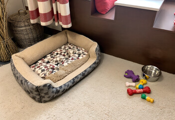Cozy Dog Bed with Toys and Bowl in a Bedroom Corner