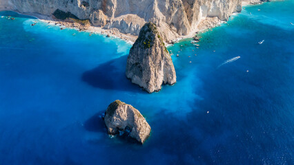 Myzithres rocks Zakynthos Greece top view with limestone cliffs turquoise shallow sea sandy coves and deep blue ocean stretching to the horizon