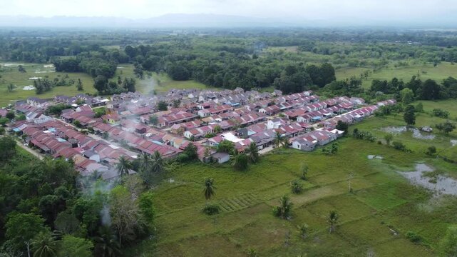 Aerial view of a residential area, some of which is still under construction, surrounded by agricultural areas