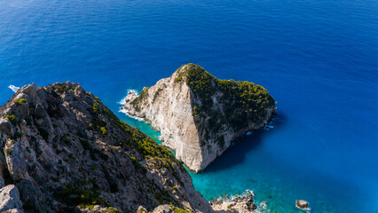 Plakaki beach coastline Zakynthos Greece aerial with dramatic rock formations turquoise cove hidden shoreline and endless Ionian Sea horizon