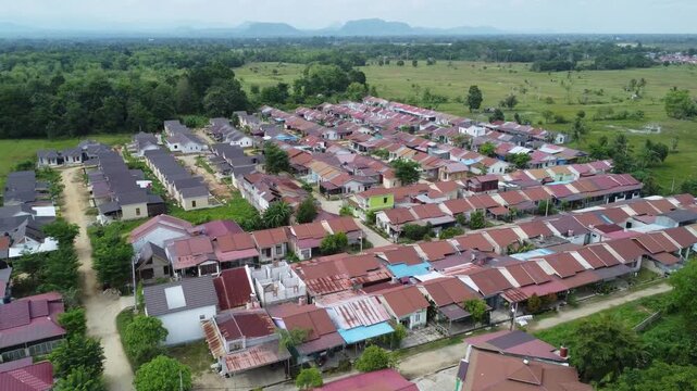 Aerial view of a residential area, some of which is still under construction, surrounded by agricultural areas