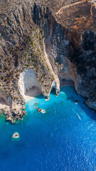 Paltakis beach Zakynthos Greece aerial view with limestone cliffs turquoise cove small sandy shore and natural sea arch formations by the coast