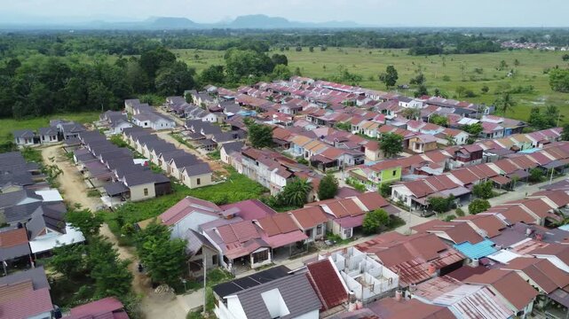 Aerial view of a residential area, some of which is still under construction, surrounded by agricultural areas