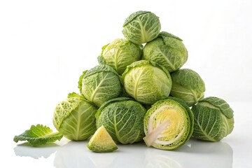 Fototapeta premium Fresh Green Cabbage Pile on White Background for Healthy Recipes