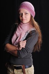 girl in a blouse and hat on a black background