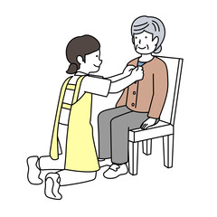 高齢者の着替えを介助する介護士