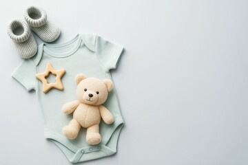 Baby bodysuit with teddy bear, booties and teether on clean light background with copyspace for baby shower or newborn promotion concept. Ai generative