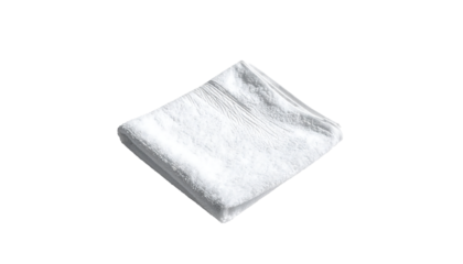 A neatly folded, small, white, plush hand towel, square-ish, soft, textured fabric