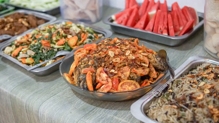 Delicious Asian Cuisine Buffet with a Whole Fried Fish Dish