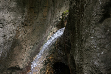 Waterfal inside a rock formation in the Carpathian Mountains, Romania