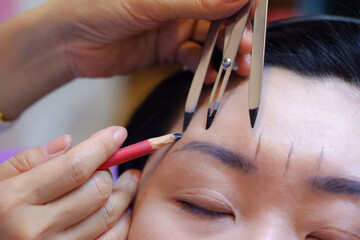 Eyebrow scale measurement before tattooing.