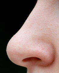 A person's nose is very prominent in the image