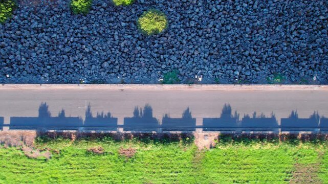Road at the Barbate Reservoir, birdseye view tilting up to reveal the lake