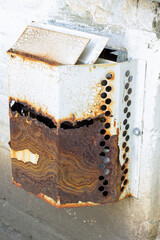 Rusty and Peeling Metal Vent Cover for Gas Boiler Outdoors