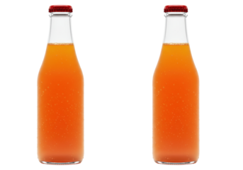 Isolated orange soda beverages inside glass bottles with red metal caps ready for consumption