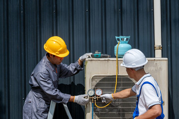 HVAC Repair: Two technicians diligently servicing an air conditioning unit, their focused actions capturing the essence of skill and dedication within the realm of technical expertise.