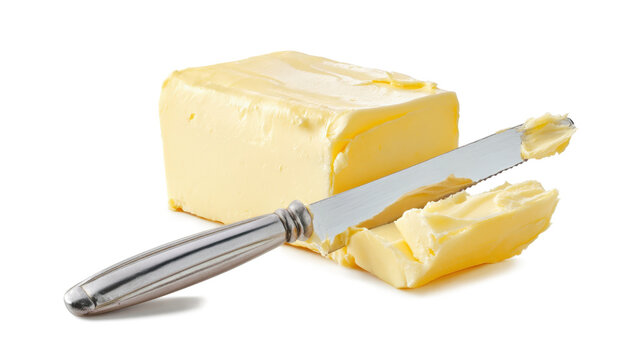 Butter or margarine cut piece on a knife isolated on a white background