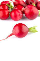 Fresh small red radishes on white background