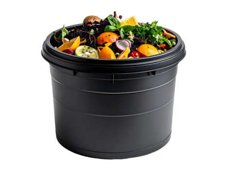 Dark grey cylindrical compost bin overflowing with vibrant fruit and vegetable scraps, herbs, and tea leaves