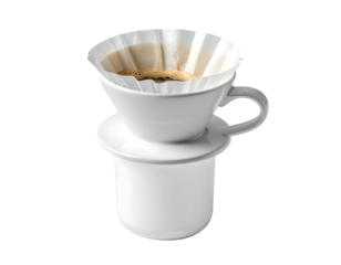 White ceramic pour-over coffee maker with paper filter, brewing dark coffee inside, sitting on a white cup