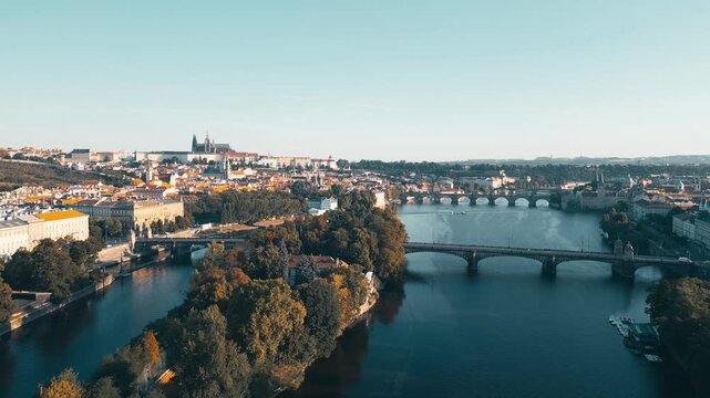 Early morning light graces Prague's stunning skyline. The Vltava River flows gently as bridges connect vibrant neighborhoods, showcasing the beauty of the city.