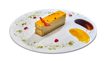 Slice of cheesecake with glossy glaze and butterfly decor on a plate with artistic sauce...