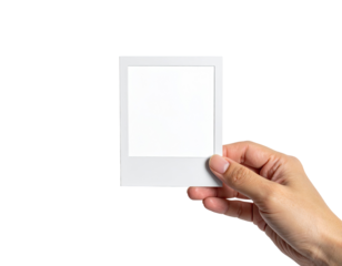 Hand holding a blank white instant photo frame