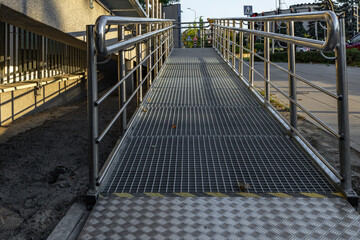 Accessible ramp for disabled people, metal ramp with handrails for strollers and disabled people, metal ramp