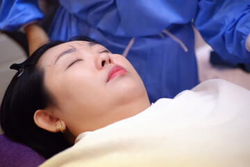 The customer lies on the bed.