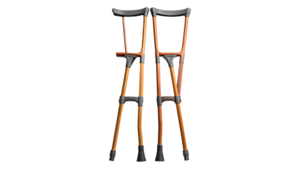 A pair of underarm crutches; light brown wood shafts with dark gray padded handgrips and tips; neatly arranged