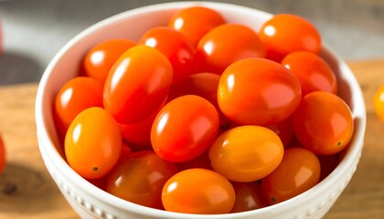 Bowl of ripe, orange cherry tomatoes