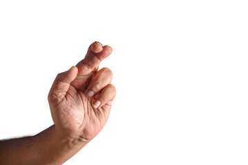 Hand Crossing Fingers Gesture on a Black Background Displaying Hope and Luck
