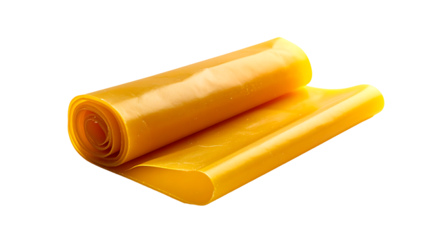 Rolled sheet of translucent, amber-yellow, pliable material; glossy surface; slightly curved; shows concentric rings from rolling