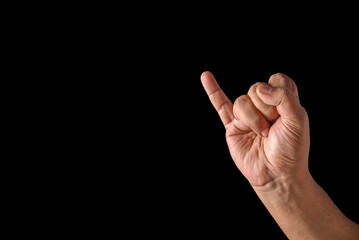 Close-Up of Hand Making a Gesture with Showing only Little Finger Raised on a Black Background