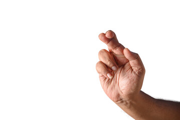 Hand Crossing Fingers Gesture on a Black Background Displaying Hope and Luck