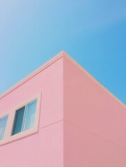 Pink building against a bright blue sky