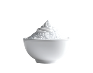 A white bowl holds a mound of fluffy, white powdered substance, peaked in the center, resembling whipped cream or confectioners' sugar